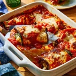 Rollitos de berenjena rellenos de ricotta, un plato gourmet y delicioso.
